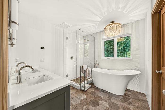 Master ensuite with freestanding soaker tub and glass shower