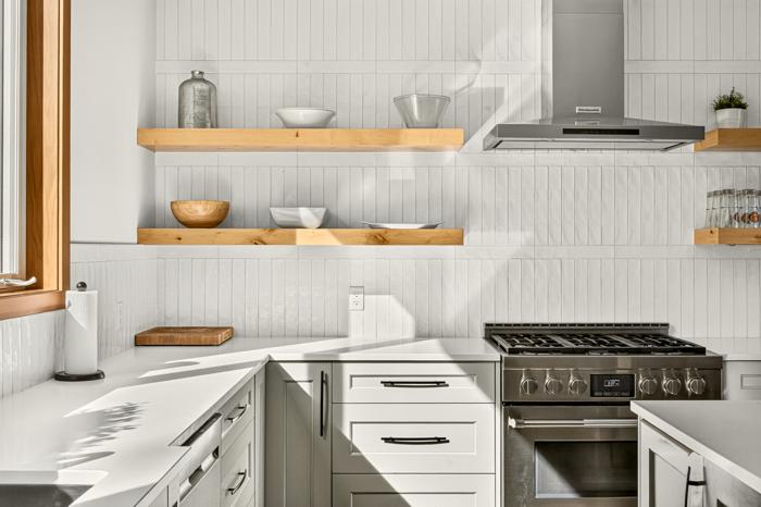 Six-burner gas range with open wood shelving