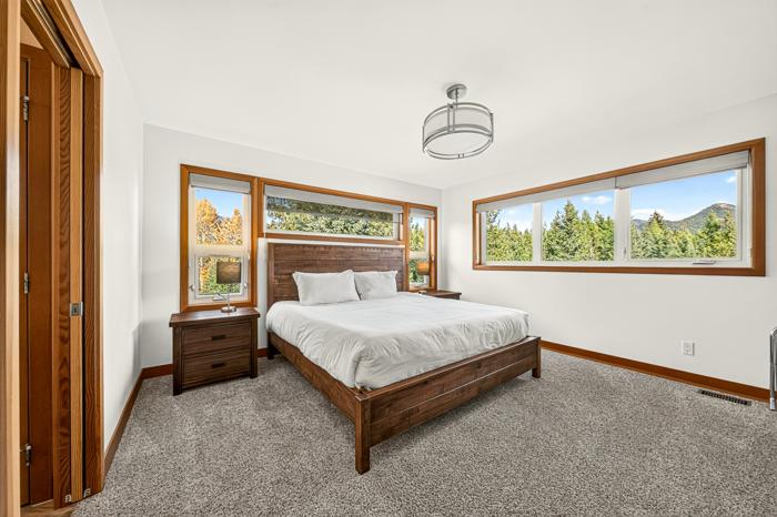 King master bedroom with mountain-view windows
